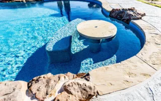 Premium pool tile finish and custom stone coping detail