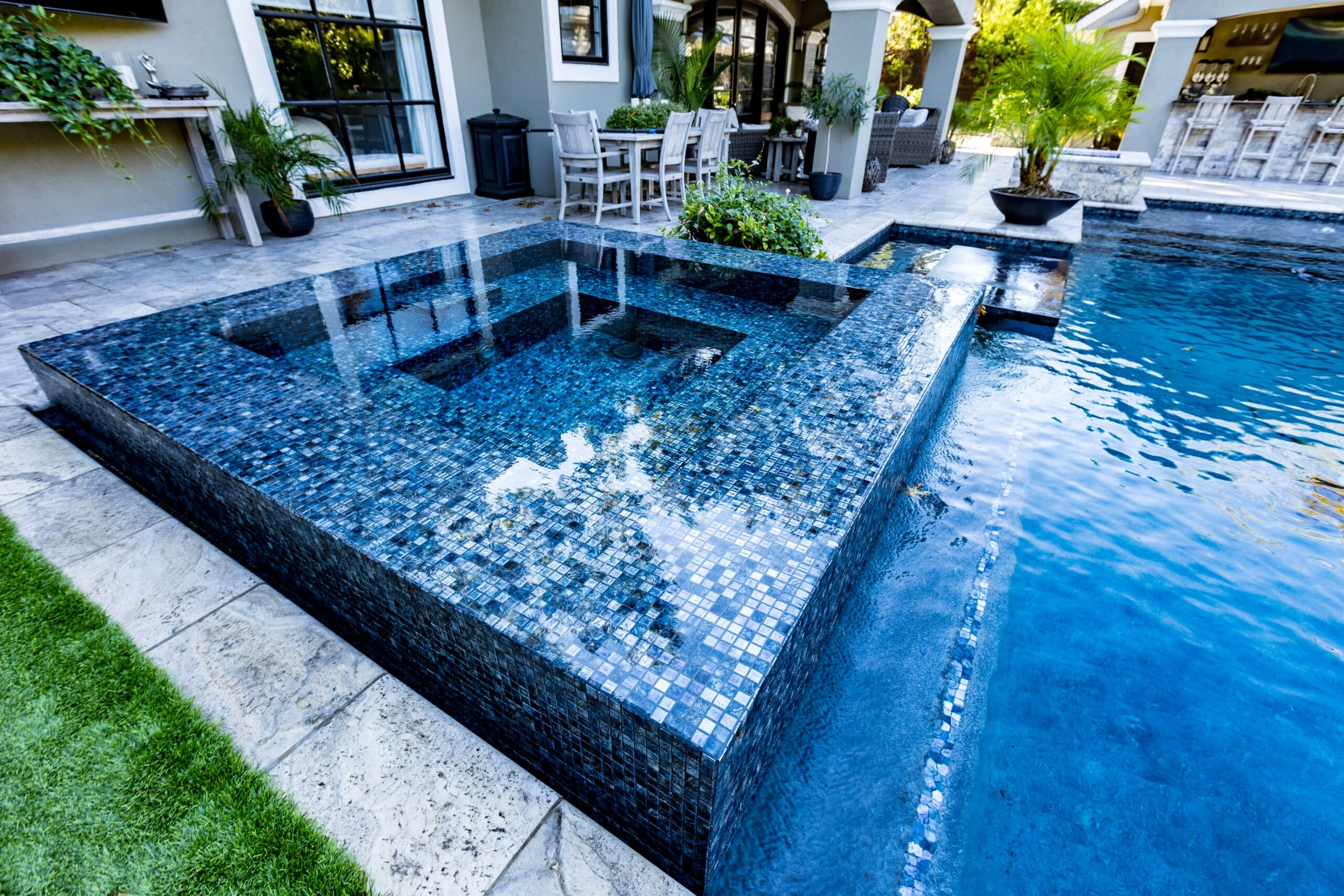 COX3-2-scaled Luxury pool design featuring a custom square spa with premium tile finish - Redfin Pools